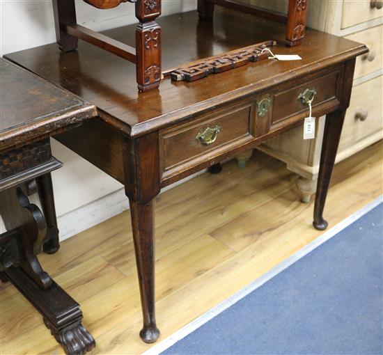 An early 19th century oak lowboy W.92cm